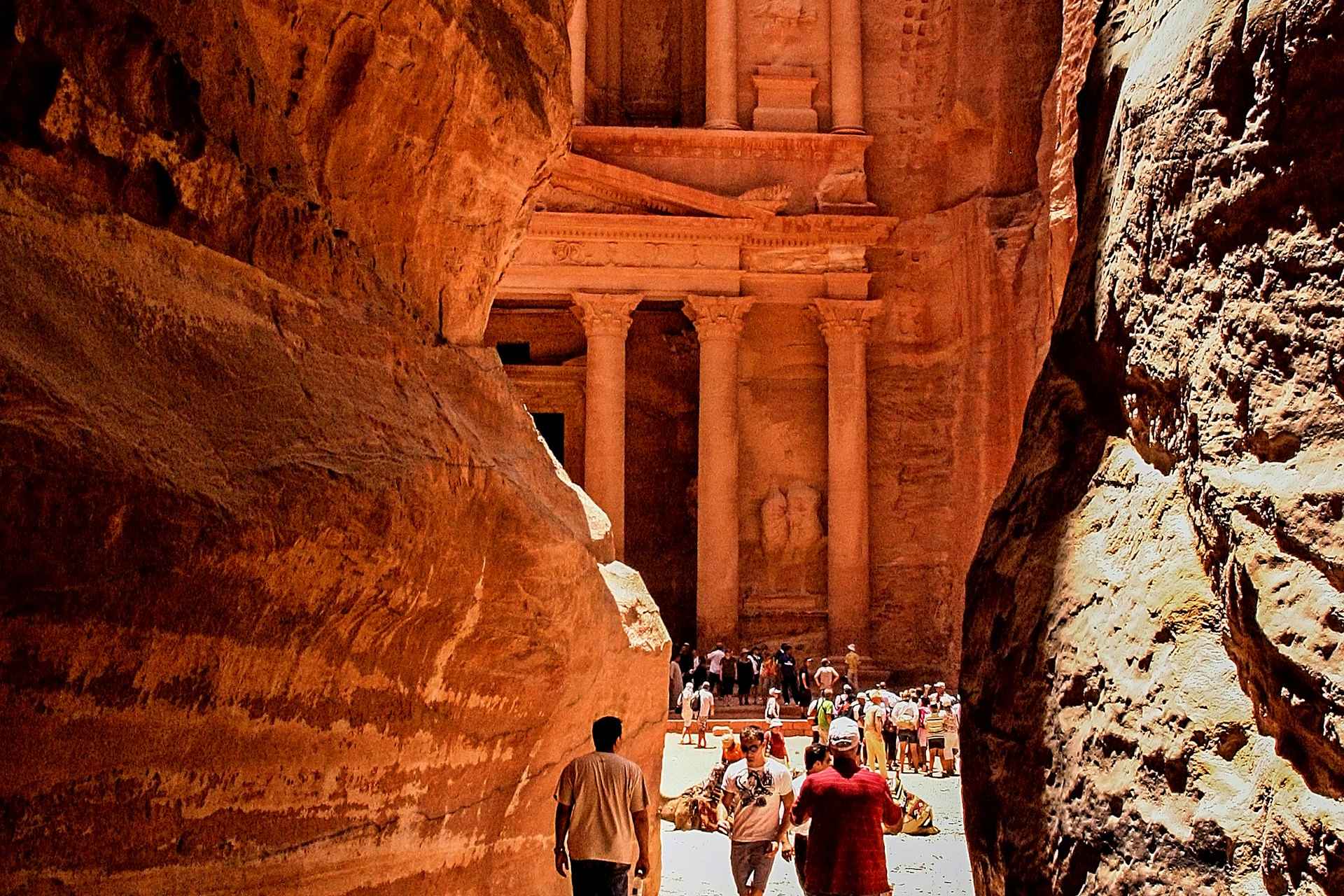 petra; jordan; ancient city; archaeological site; travel destination; middle east; red rose city; nabateans; world wonder; historical monument; ruins; rock-cut architecture; unesco world heritage site; valley; tourism; jordanian desert; bedouin culture; donkey rides; camel caravans; tombs; treasury; al-khazneh; monasteries; siq; canyon; temples; history; tourist attraction; architecture; ancient civilization; archaeological excavation; carved into rock; cliffs; conservation; preservation; excavations; cultural heritage; antiquities; sandstone; middle eastern history; arabian peninsula; lost city; petra by night; hiking trails; mountainous terrain; facades; sculpted architecture; religious significance; religious ceremonies; water channels; cisterns; roman ruins; byzantine period; ancient trading hub; silk road; spice route; biblical era; pilgrimage site; religious beliefs; archaeological surveys; fragile environment; scenic beauty; natural wonders; carved structures; travel photography; travel blog; travel tips; explore petra; adventure travel; hidden gem; off the beaten path.